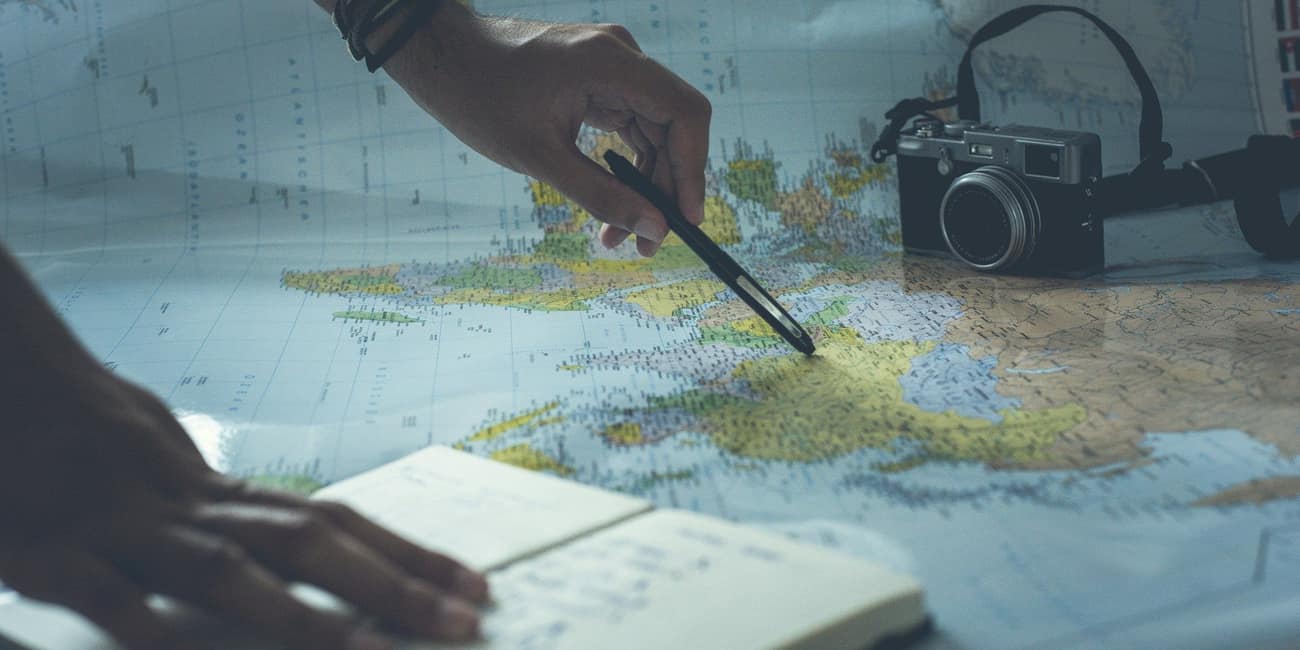 A travel professional planning a route on a map