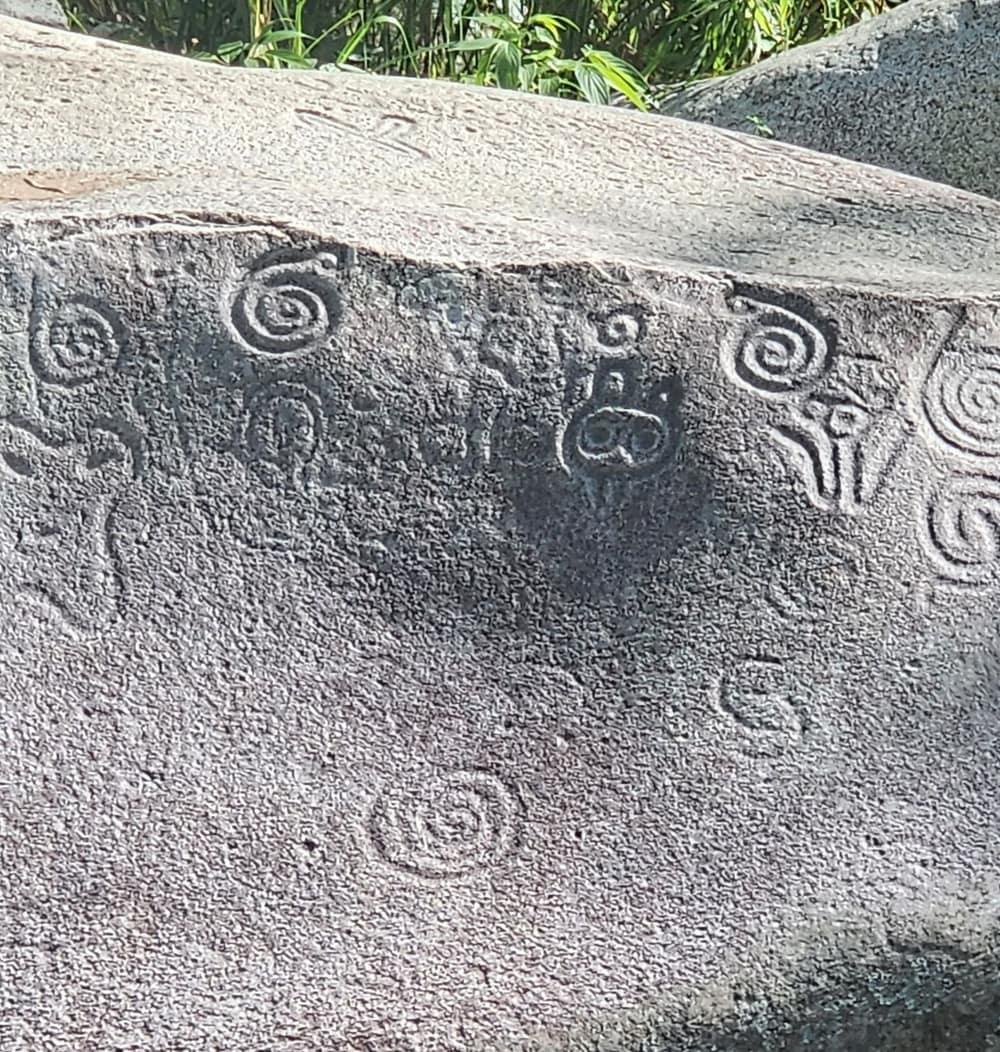 Taíno petroglyphs carved into the Piedra Escrita boulder