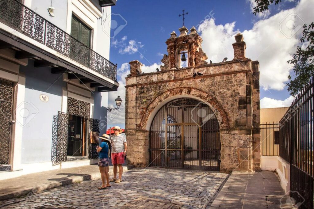 Couple traveling to Puerto Rico experiencing Bucketlist Tours’ Old San Juan Ageless Elegance, Heritage, and Spirits private tour, exploring America's oldest churches and learning about the history of faith and sacred relics in Old San Juan.