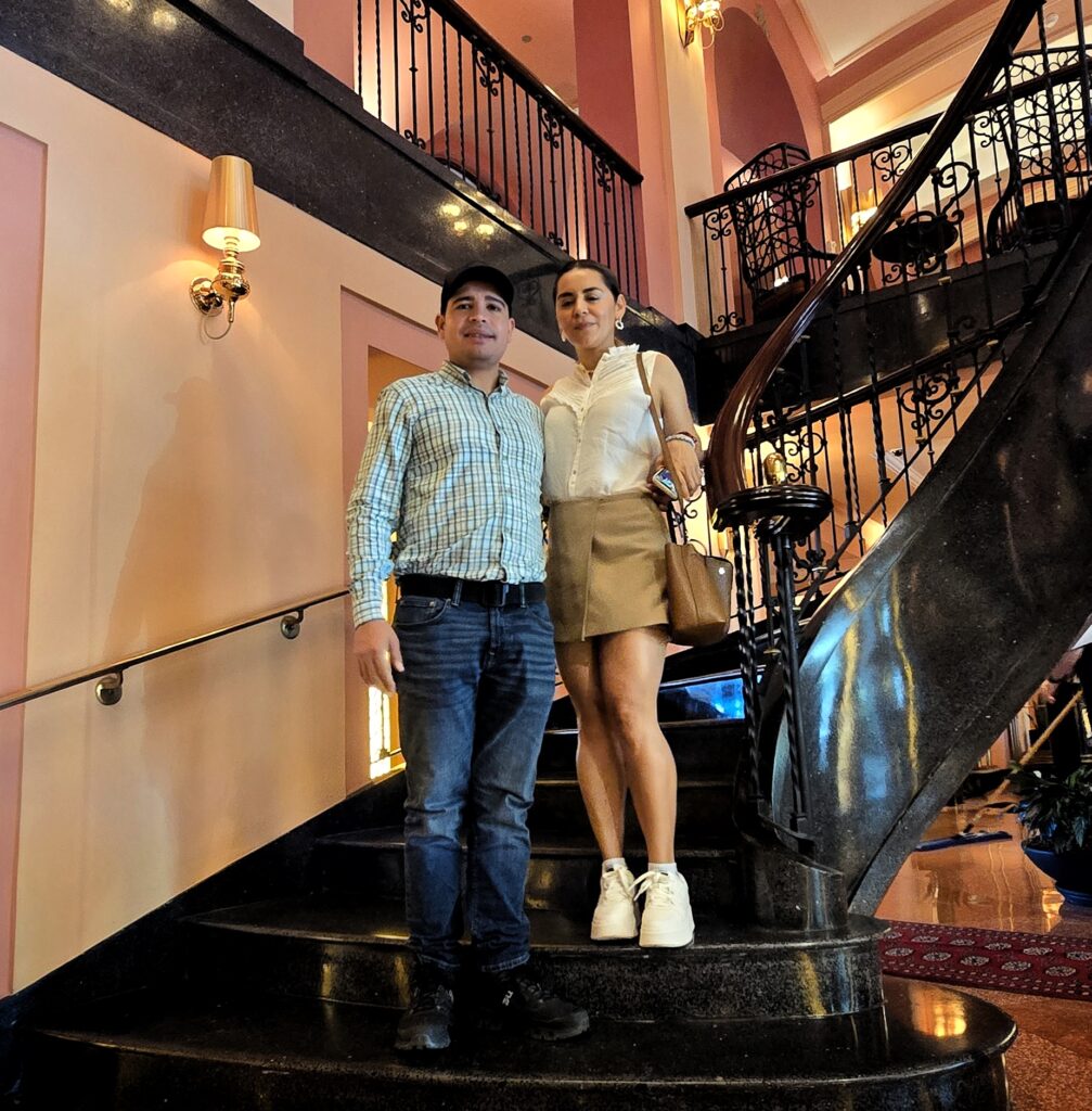 Couple experiencing Bucketlist Tours’ Old San Juan Ageless Elegance, Heritage, and Spirits private tour at the Condado Vanderbilt Hotel, surrounded by the timeless beauty of early 1900s elegance.