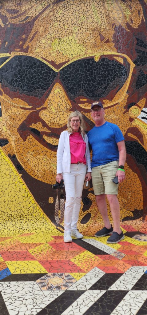 Senior couple traveling to Puerto Rico experiencing Bucketlist Tours' Old San Juan Ageless Elegance, Heritage, and Spirits private tour, comfortably discovering San Juan's vibrant urban art scene in a relaxed and enriching way.