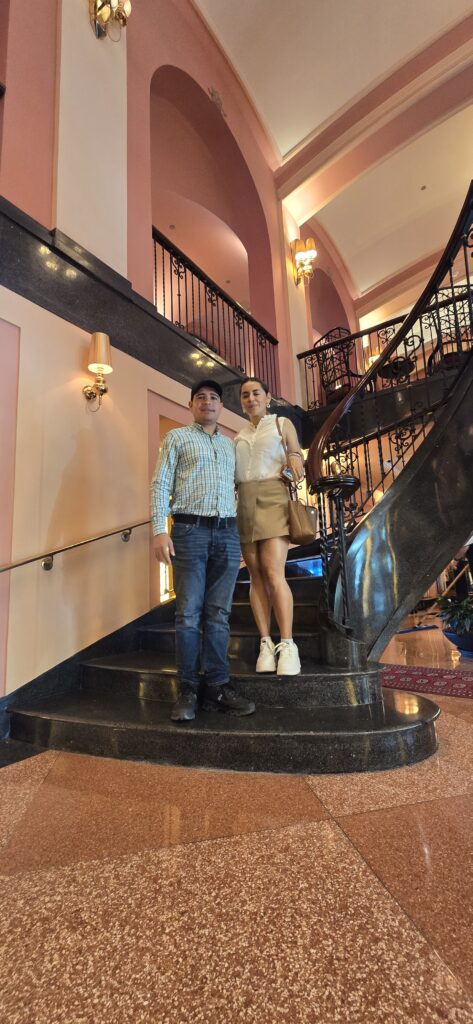 Couple experiencing Bucketlist Tours’ Old San Juan Ageless Elegance, Heritage, and Spirits private tour at the Condado Vanderbilt Hotel, surrounded by the timeless beauty of early 1900s elegance.