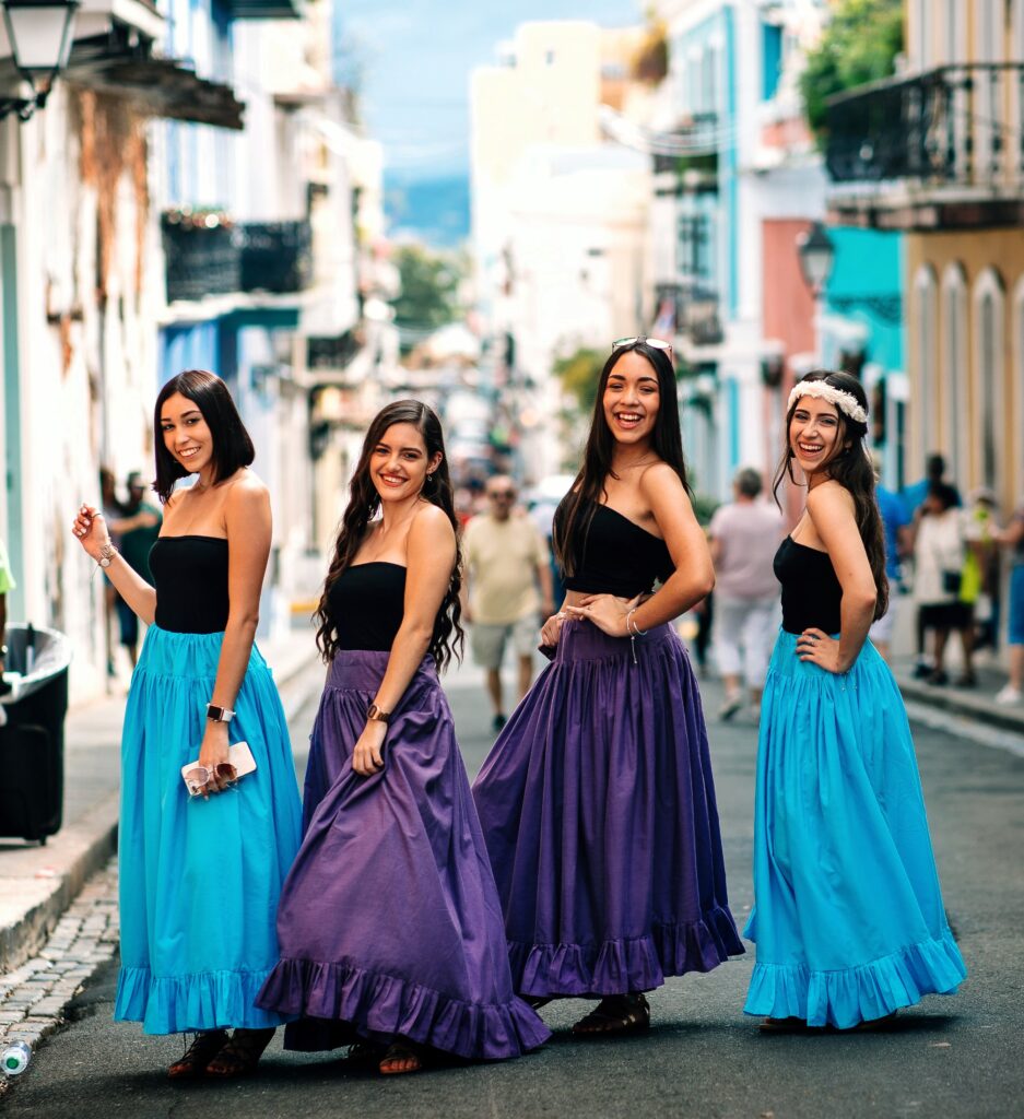 A lively bachelorette group enjoying a sunny day in Old San Juan, walking along the historic Calle del Cristo, the oldest paved street in the Americas. With its colorful colonial buildings and rich history, this street is just one of the many landmarks featured in Bucketlist Tours’ Colonial Wonders and Serene Rainforest private Old San Juan tour.