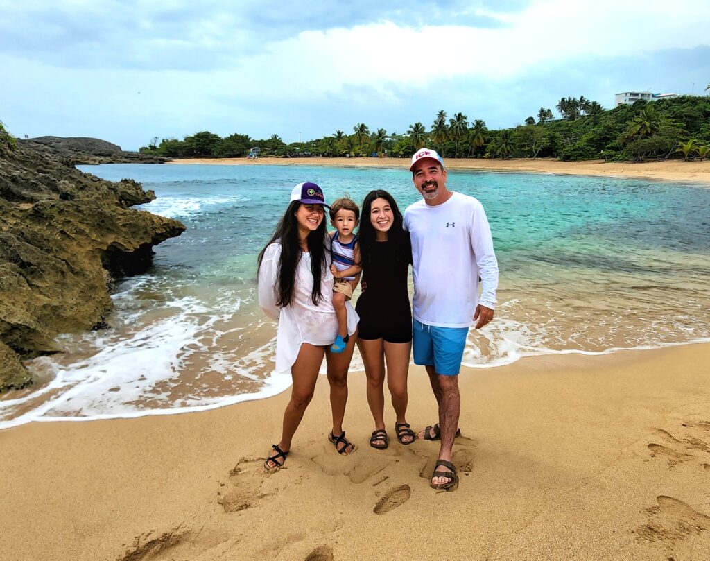 A family of four, with a teenager and toddler, enjoys the pristine sands of Mar Chiquita Beach. They are ready for snorkeling in the crystal-clear waters, hiking through the iconic rock formations before heading to the Rainforest Waterfalls. This unforgettable experience is part of Bucketlist Tours’ Ocean Edge to Jungle’s Heart private adventure, available from San Juan, Dorado, and Rio Grande.