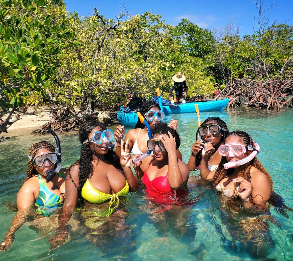 A vibrant bachelorette party from Atlanta, staying at the elegant Condado Vanderbilt Hotel, is captured by their guide and ambassador as they prepare to snorkel and explore the mangrove-lined channels of *La Parguera Cays*. With sunny skies and crystal-clear waters, this adventure was part of Bucketlist Tours' Mystic Waters Under the Sun & Stars. This experience combine a *road trip*, *boat tour*, a *snorkeling tour*, a ,*bioluminicent bay tour*, and was part of their Discover Puerto Rico 3 Day package. The only of its kind, offering an exclusive and unique package delivering the top 10 items of any Puerto Rico Vacation Bucketlist and offered offered from San Juan, Dorado, Rio Grande, Isabela and Ponce.