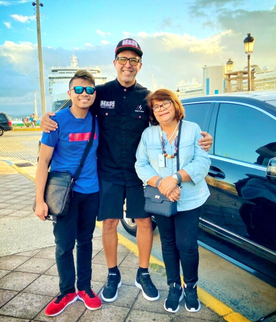 A Filipino mother and son, traveling to Puerto Rico on a *Royal Caribbean* Cruiseship, are captured alongside their guide and ambassador after an enriching journey through Old San Juan’s rich colonial history. Smiling brightly, they pose by their luxury vehicle, having explored the *San Juan Islet* and learned about over 90 landmarks, including the *Capitol Building*, the *Walkway of the Presidents* honoring U.S. presidents who have visited the island, the North Wall, and the vibrant main streets of *Old San Juan*. This unforgettable experience was part of their 2-hour Old San Juan's Whispers of Time private tour, the most comprehensive and history-rich sightseeing exploration of Old San Juan. Perfectly tailored for cruise ship passengers, this tour offers three customizable durations: 2 hours for a comfortable sightseeing overview in a luxury air-conditioned vehicle, 3 hours for photo stops and further exploration, and 4 hours for an immersive experience with extended stops. Thoughtfully curated for couples, families with children, seniors, and those seeking a low-effort yet enriching journey, this *Old San Juan tour* reveals Puerto Rico’s transformation after becoming a Commonwealth of the United States.