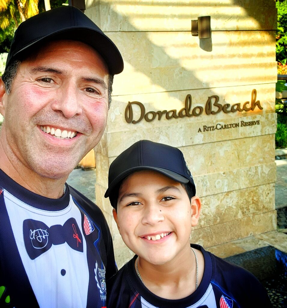 A joyful selfie of Marcos & Papito!, co-founders of Bucketlist Tours, proudly posing at the reception area of the Ritz Carlton Reserve at Dorado Beach after returning a family of four to the exclusive property. This moment not only symbolizes the realization of a dream—from humble beginnings as a countryside boy and an Uber driver, Papito turned his and Marcos' vision into a five-star reality, but the begining of their journey as the most exclusive experience provider in Puerto Rico. Our exceptional service to guests staying at Puerto Rico’s most prestigious resorts validates Bucketlist Tours' dedication to excellence. This image represents more than just success; it stands as proof that the American Dream is alive, transforming aspirations into the most memorable and exclusive way to experience and discover Puerto Rico.